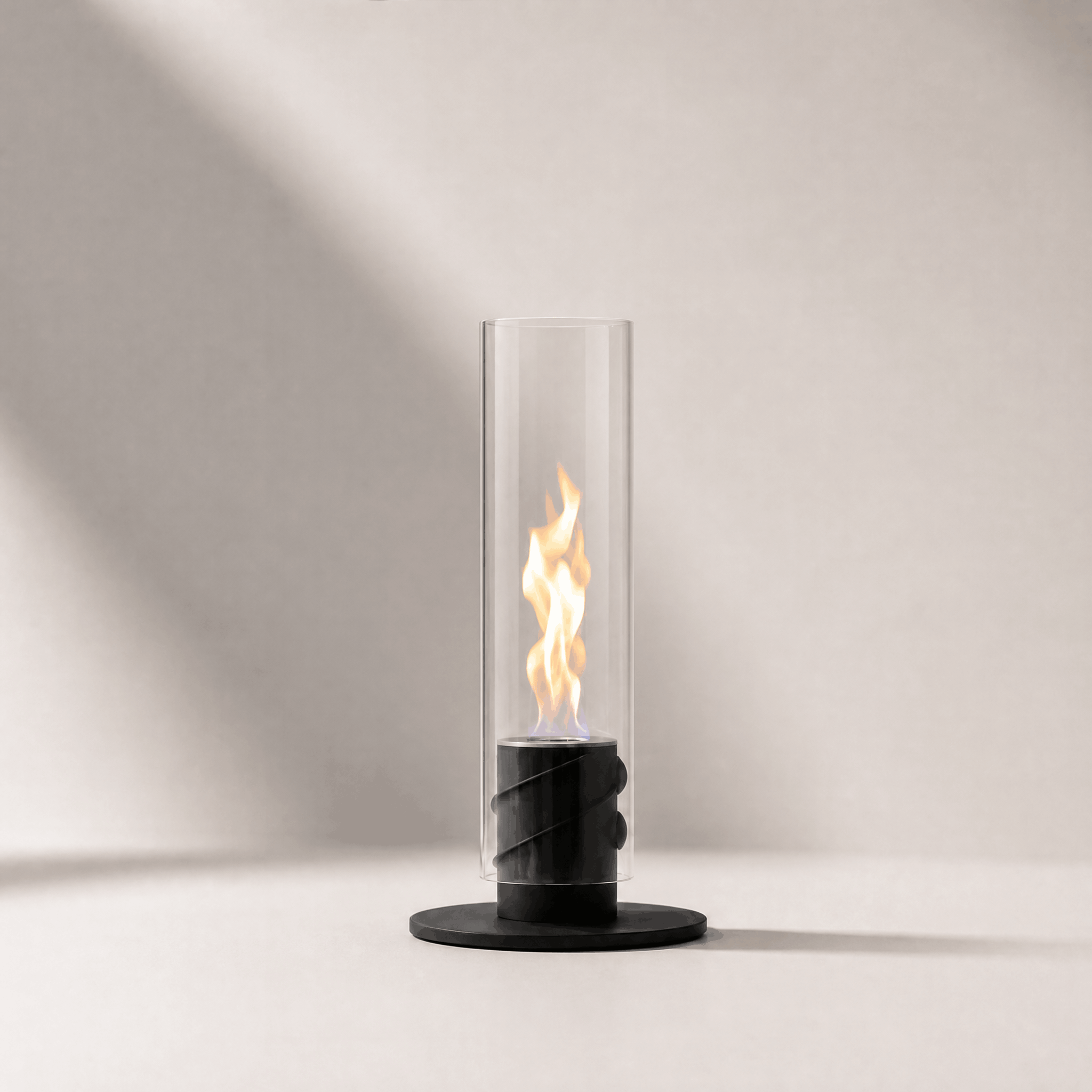 CYLINDER 40 bioethanol fireplace, tall glass cylinder with a spiral black burner